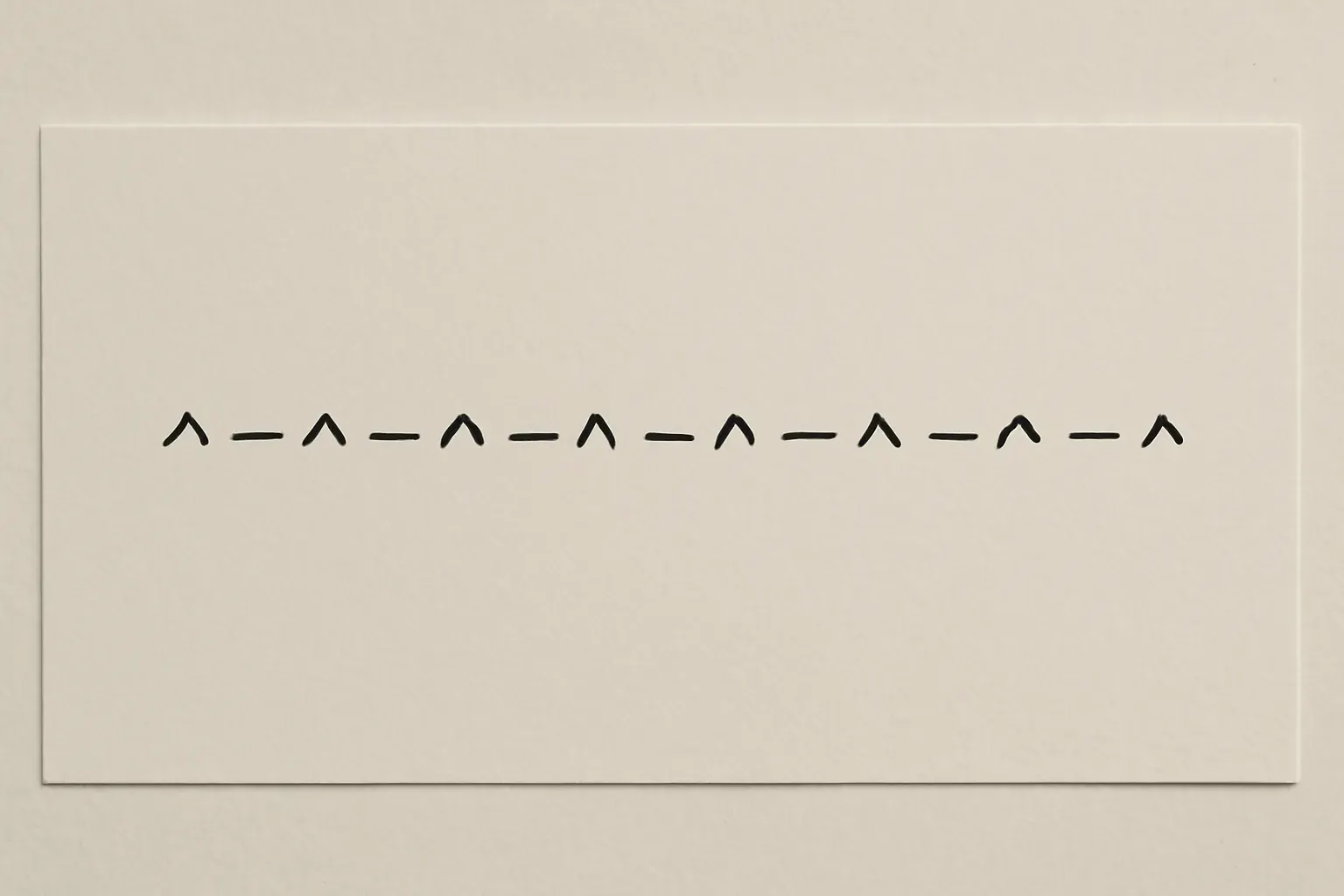 A duotone proofing sheet with a connected left-to-right sequence of ink marks.