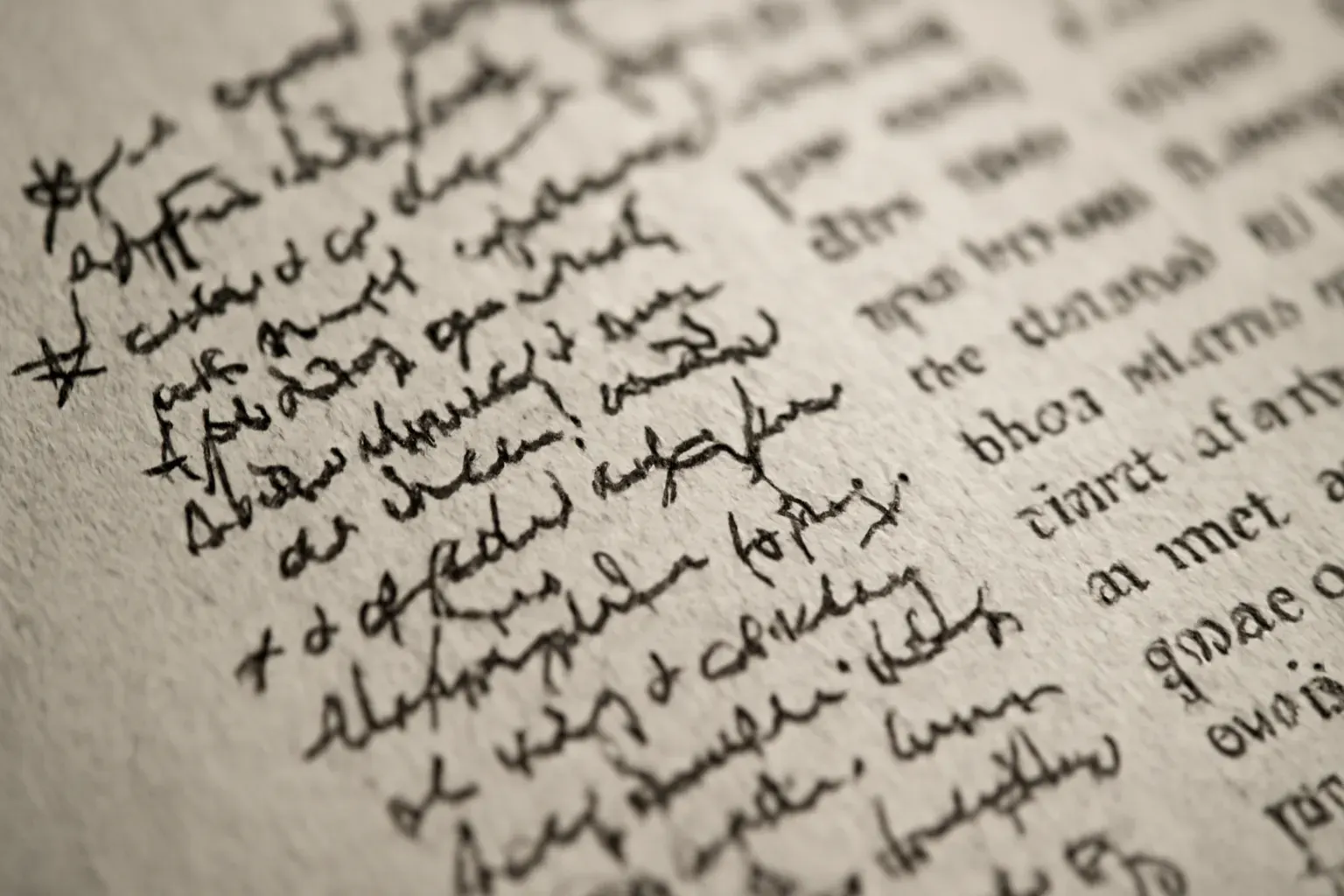 A duotone close crop of a single marked-up page, coral annotations in the margin.